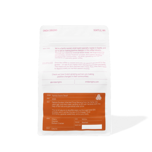 Back of a food packaging with text and branding on a white background Decaf colombian coffee bag with pink and blue design on a white background single origins specialty coffee beans