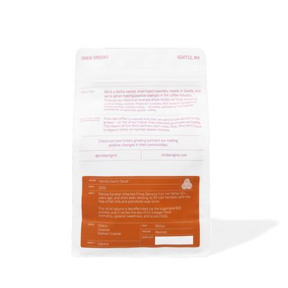 Back of a food packaging with text and branding on a white background Decaf colombian coffee bag with pink and blue design on a white background single origins specialty coffee beans