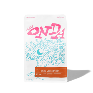 Onda coffee bag with pink and blue design on a white background decaf coffee from colombia whole bean coffee gifts