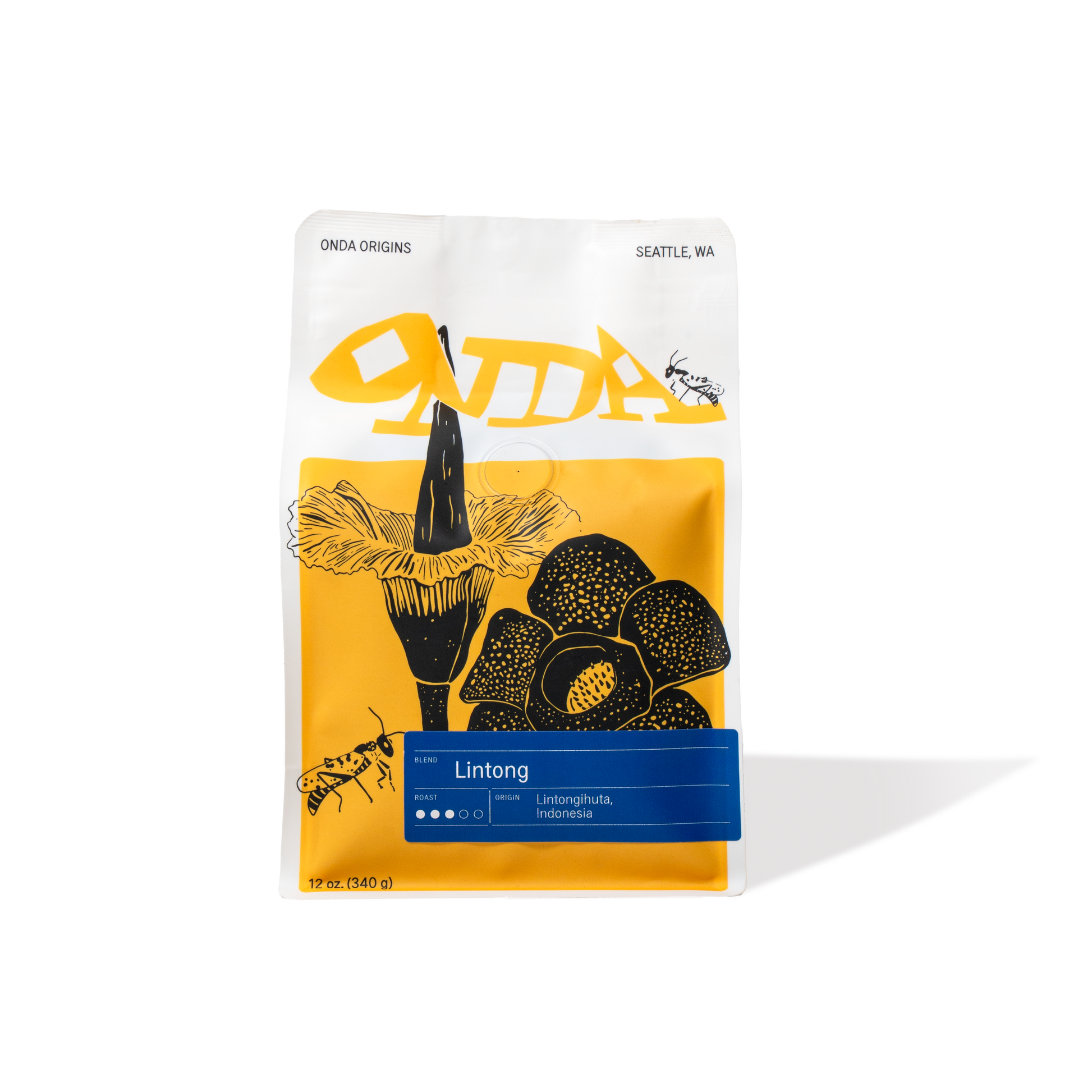 White coffee bag with yellow and black design, specialty coffee from Indonesia, single origin specialty coffee, medium roast whole bean coffee bag