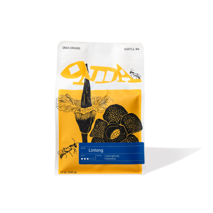 White coffee bag with yellow and black design, specialty coffee from Indonesia, single origin specialty coffee, medium roast whole bean coffee bag