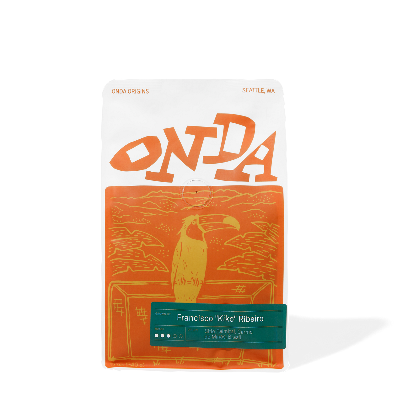 Orange and white package with 'ONDA' branding and a toucan illustration on a white background. Single origin coffee beans from brazil